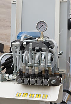 Hydraulic tubes, fittings and levers on control panel