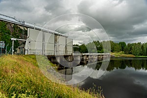 Hydro electric power plant with dark overcast sky