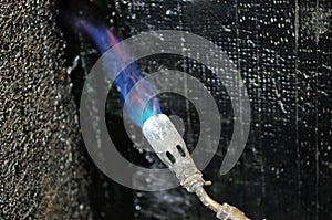 Hydro isolation of house with butane torch photo