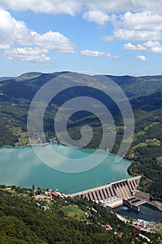 Hydroelectric power plant Perucac on Drina river and hills photo