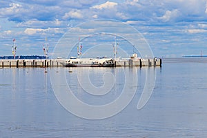 Hydrofoil boats moored at open coast of Gulf of Finland, in Peterhof suburb of St. Petersburg, Russia