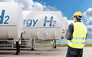 Hydrogen tank trailers stand in a row. Clean fuel concept