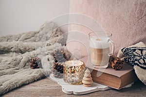 Hygge Scandinavian style concept with latte macchiato coffee cup photo