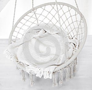 Hygge scene with hammock chair on white background. Cozy place for weekend relax in the room