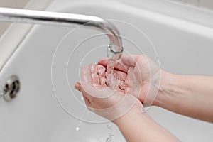 Hygiene. Cleaning Hands. Washing hands on sink