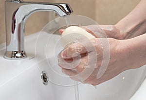 Hygiene. Cleaning Hands. Washing hands with soap. Woman`s hand with foam. Protect yourself from coronavirus COVID-19 pandemia