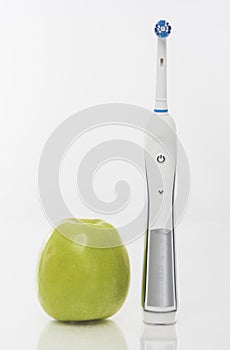 Hygiene Concept: Green Apple With Toothbrush