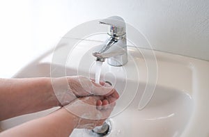 Hygiene concept, thorough hand washing with water and soap, important infection prevention against contagious disease like