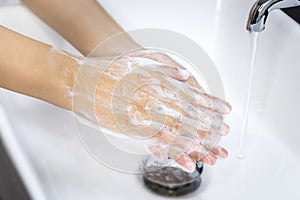 Hygiene concept. washing hands with soap in sinks, keep clean to protect from virus and bacteria disease.