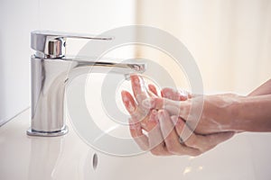 Hygiene concept. Water flowing from faucet.