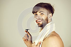 Hygiene and grooming of happy man smiling with safety razor