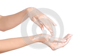 Hygiene and health protection topic: a woman's hand in soapsuds isolated on white background in studio