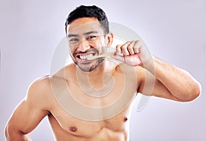 Hygiene, portrait and man with bamboo brush for teeth, sustainability and biodegradable of product. Studio, white