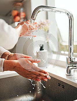 Hygiene, water and washing hands in a kitchen basin for health, cleaning and fresh before cooking. Morning