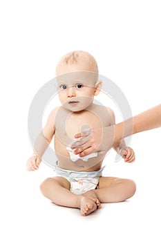Hygiene - young momy wiping the baby skin with wet wipes isolated on a white background