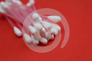 Hygienic cotton buds on a red background