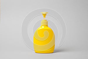 Hygienic cream liquid soap in yellow plastic bottle mockup