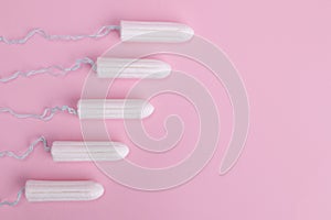 Hygienic female tampon on a pink background