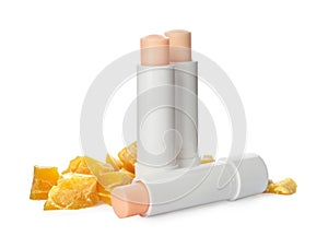 Hygienic lipsticks and natural beeswax on white background