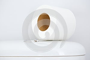 Hygienic paper on white toilet tank