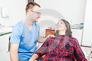 Hygienist holding patient as being trustworthy