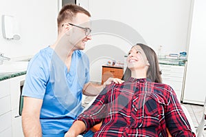 Hygienist holding patient as being trustworthy photo