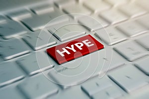 HYPE red Button on Computer Keyboard. blurred in motion background.