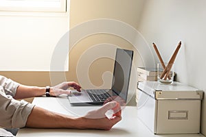 Hyperactive man has difficulty concentrating while working and playing with a fidget spinner toy