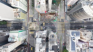Hyperlapse time-lapse of car traffic on road junction intersection in Hong Kong city downtown. Drone aerial top view