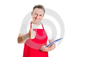 Hypermarket employee holding clipboard