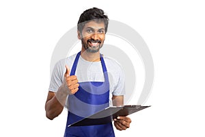 Hypermarket manager with thumb up holding clipboard