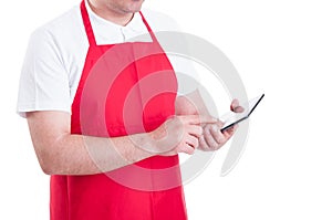 Hypermarket merchandiser with tablet pc at work