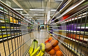 Hypermarket motion blur fruits photo