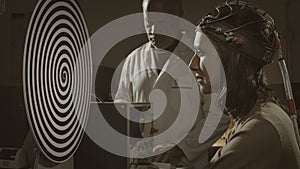 Hypnosis experiment in a vintage style lab photo