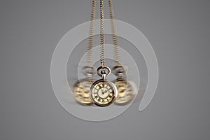 Hypnosis session. Vintage pocket watch with chain swinging on grey background, motion effect