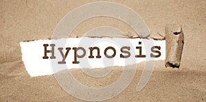 Hypnosis word appearing behind torn brown paper. Reduce stress psychological healthcare concept