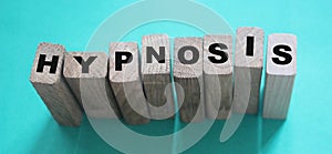 HYPNOSIS word on wooden blocks. Psychology hypnotherapy concept