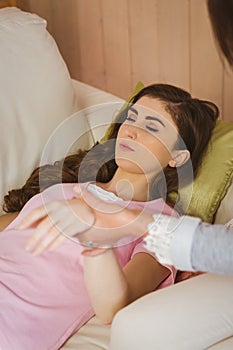 Hypnotherapist holding her patients wrist