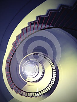 almost hypnotic effect of a spiral staircase that rises upwards  with an antique effect