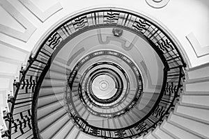 Hypnotic pattern of a spiral staircase, monochrome