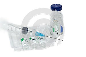Hypodermic needle with drop on medical syringe and medication am