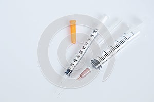 Hypodermic syringe on white background