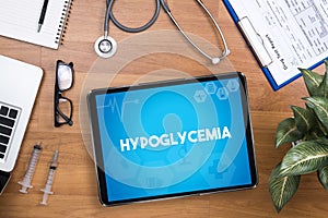 Hypoglycemia Professional doctor use computer and medical equipment all around photo