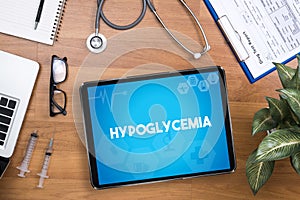 Hypoglycemia Professional doctor use computer and medical equipment all around