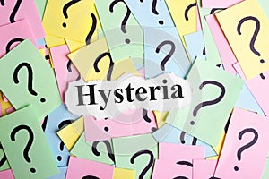 Hysteria Syndrome text on colorful sticky notes Against the background of question marks