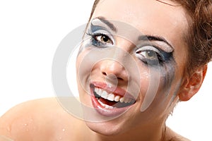 Hysterics crying and smiling woman with wet makeup over white photo