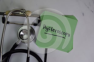 Hysteroscopy write on sticky notes isolated on Wooden Table