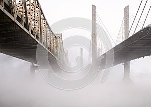 I-65 twin bridges over River Ohio covered in fog in Louisville, Kentucky