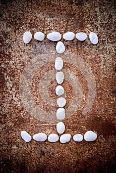 'I' alphabet made form white stone