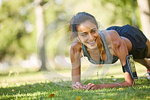 I believe that exercise makes life better. a beautiful young woman exercising outdoors on a sunny day.
